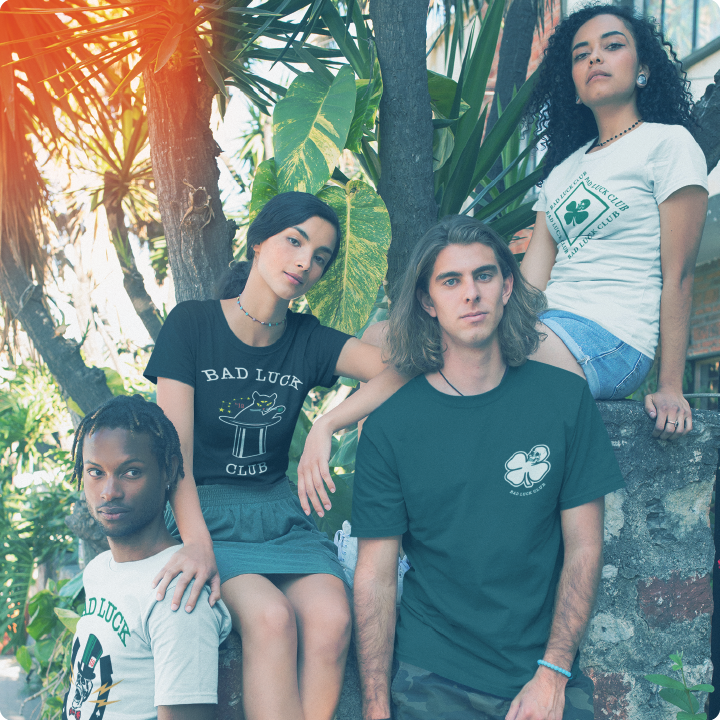 a group of teenagers wearing zdropped bad luck club collection in nature