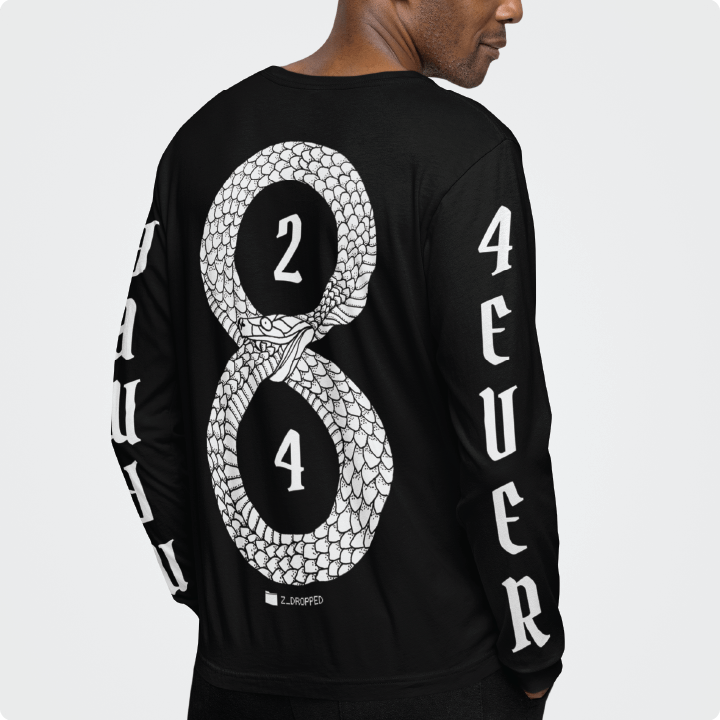 Person wearing the rear view of a black unisex long sleeve with the white 8 and 24 mamba design on the back and text that reads "mamba 4 ever" on the sleeves in white