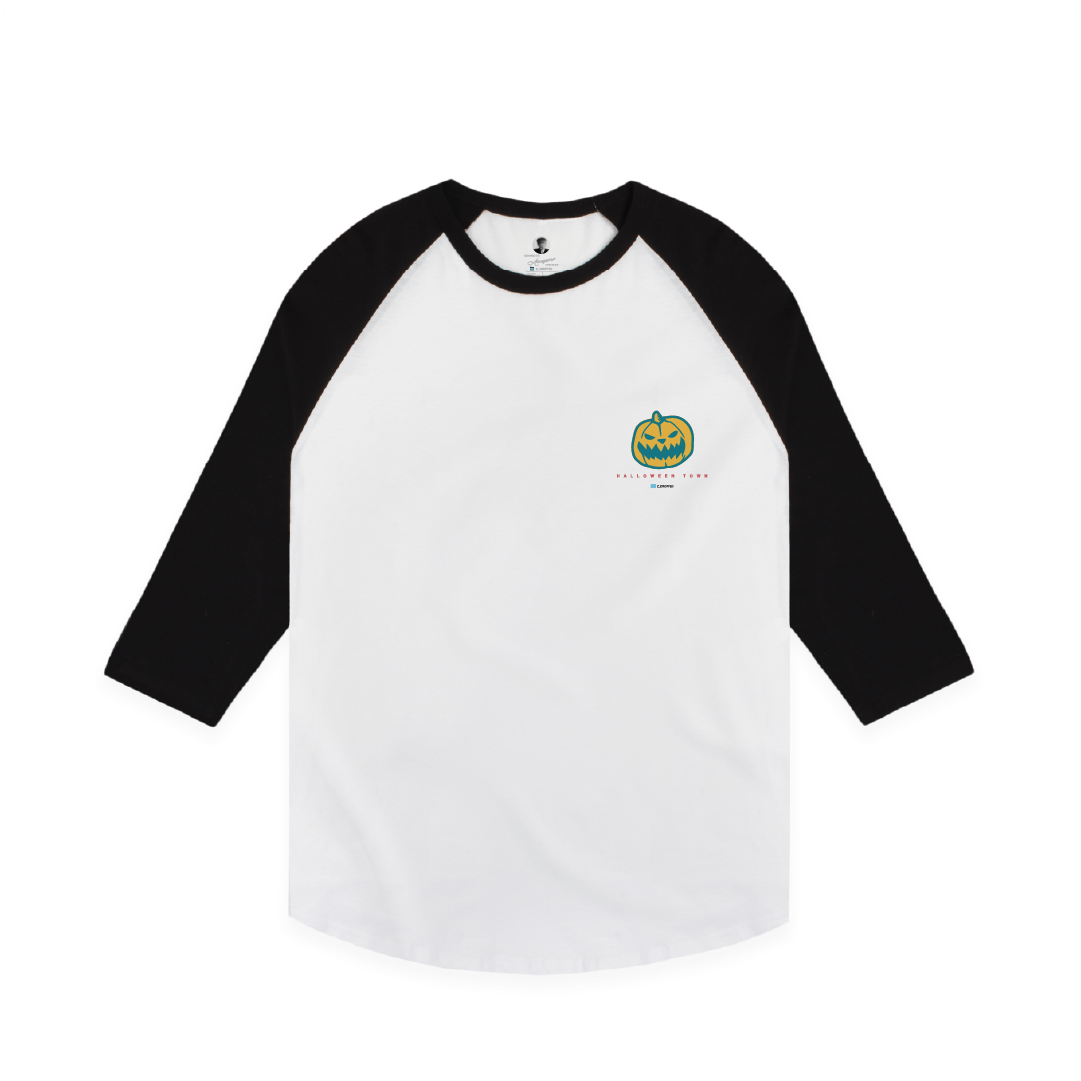 White baseball shirt with black sleeves featuring a pumpkin logo on a white background