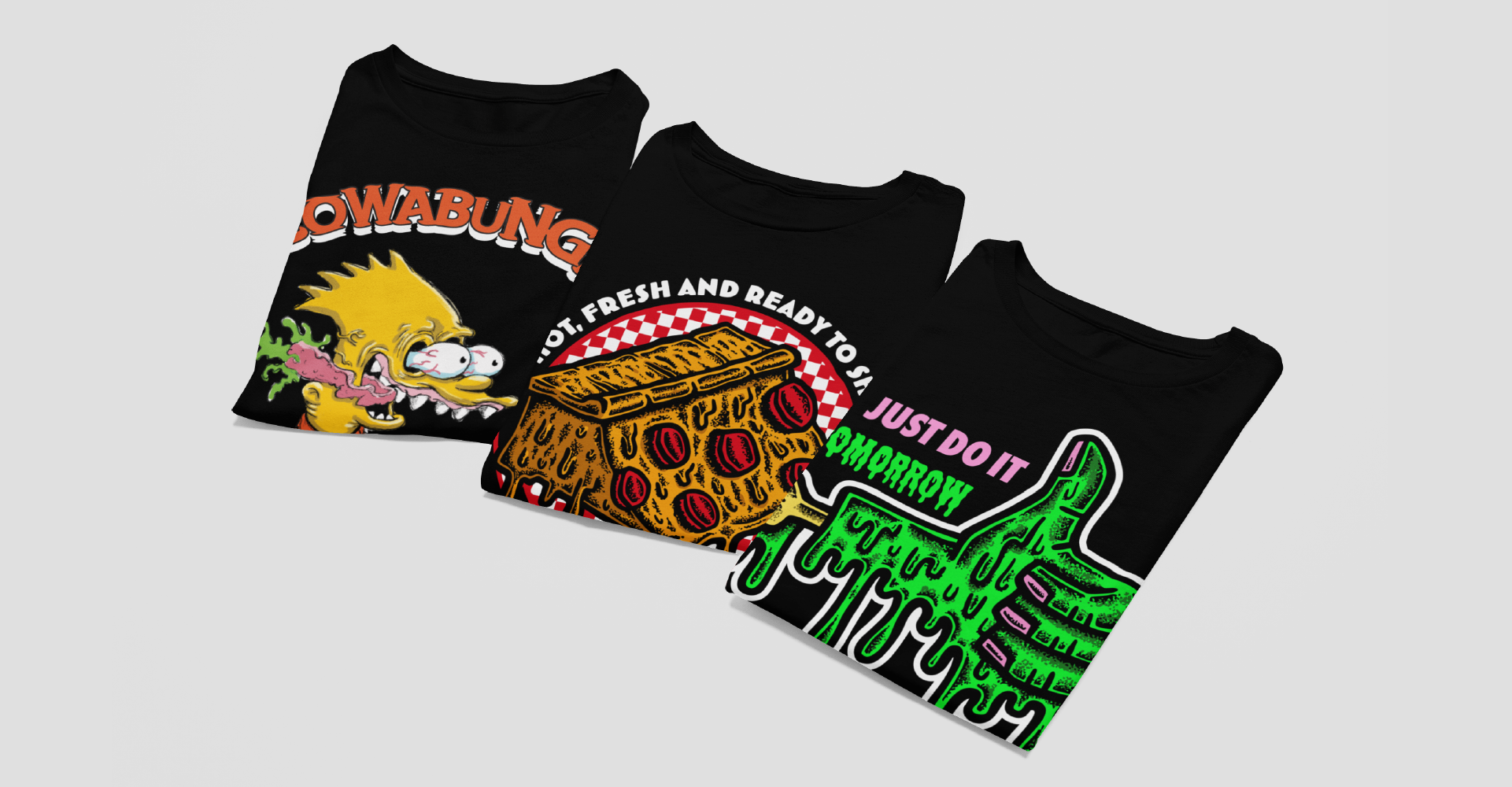 Three black t-shirts with colorful graphic designs on a light gray background
