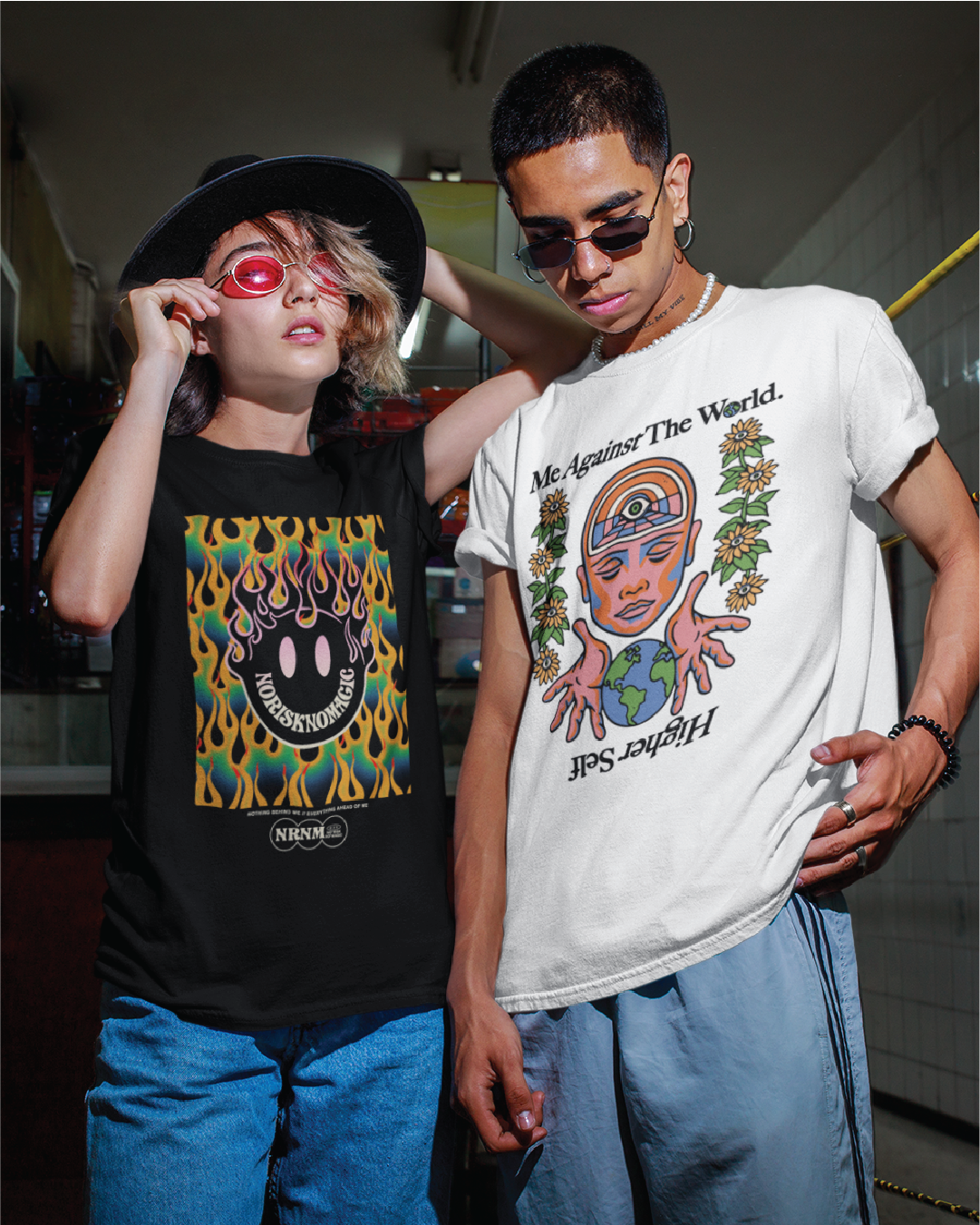 a boy and a girl wearing zdropped graphic t-shirts with unique designs in an urban setting.