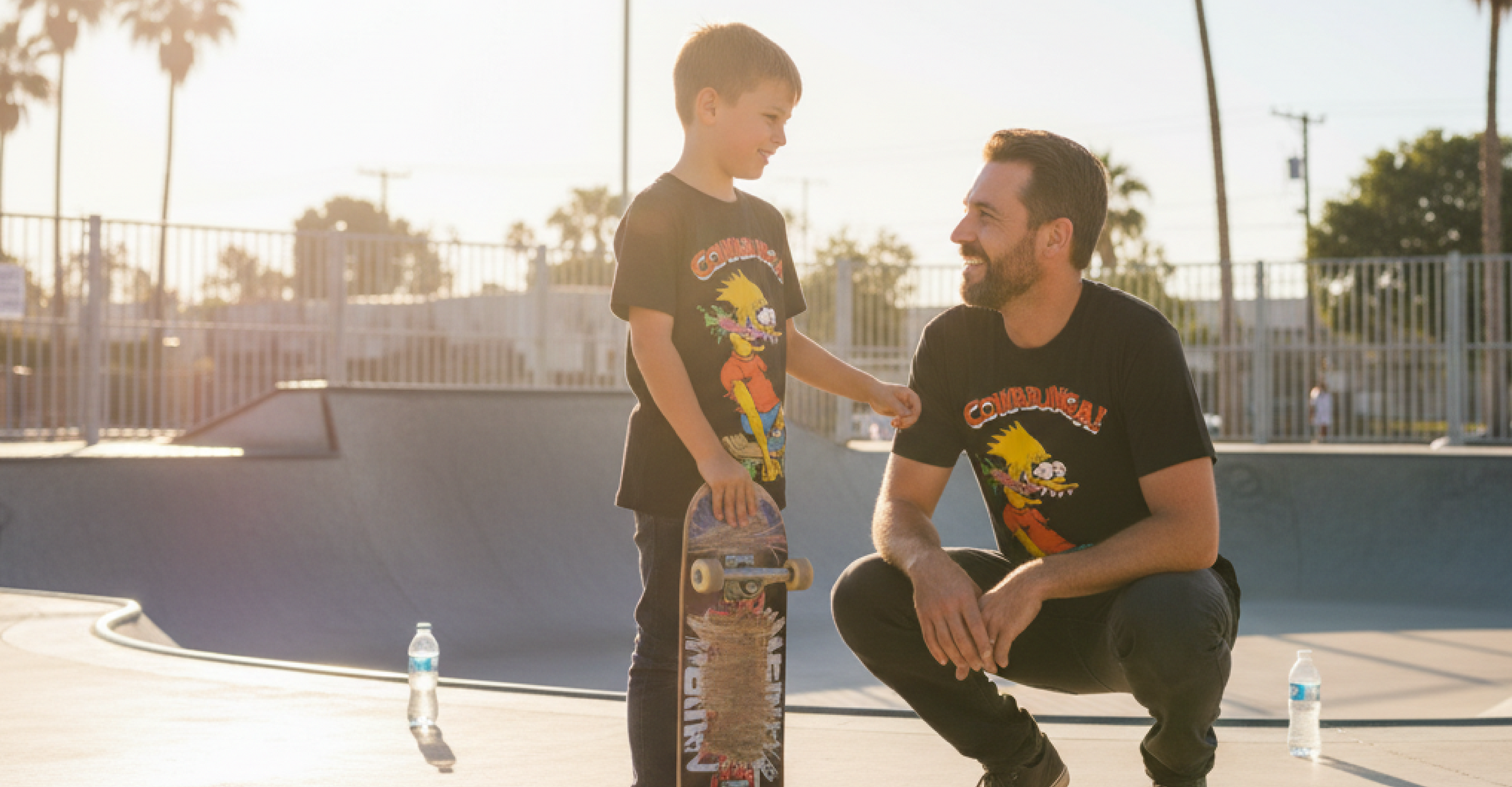 Father and Son wearing matching Bart Roth Tees at a skate park for Fathers Day.
