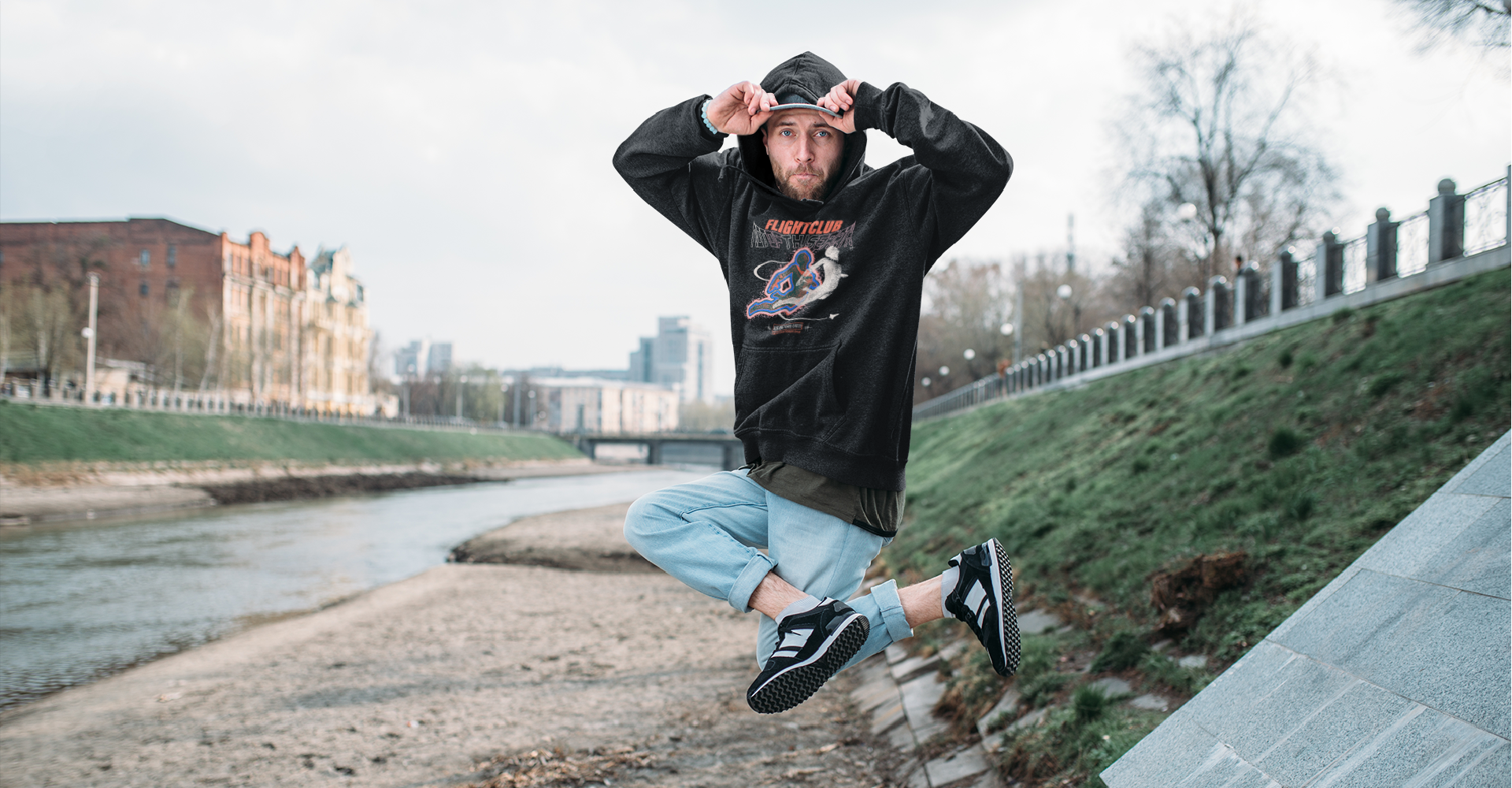 man jumping in black not of this earth black zdropped hoodie