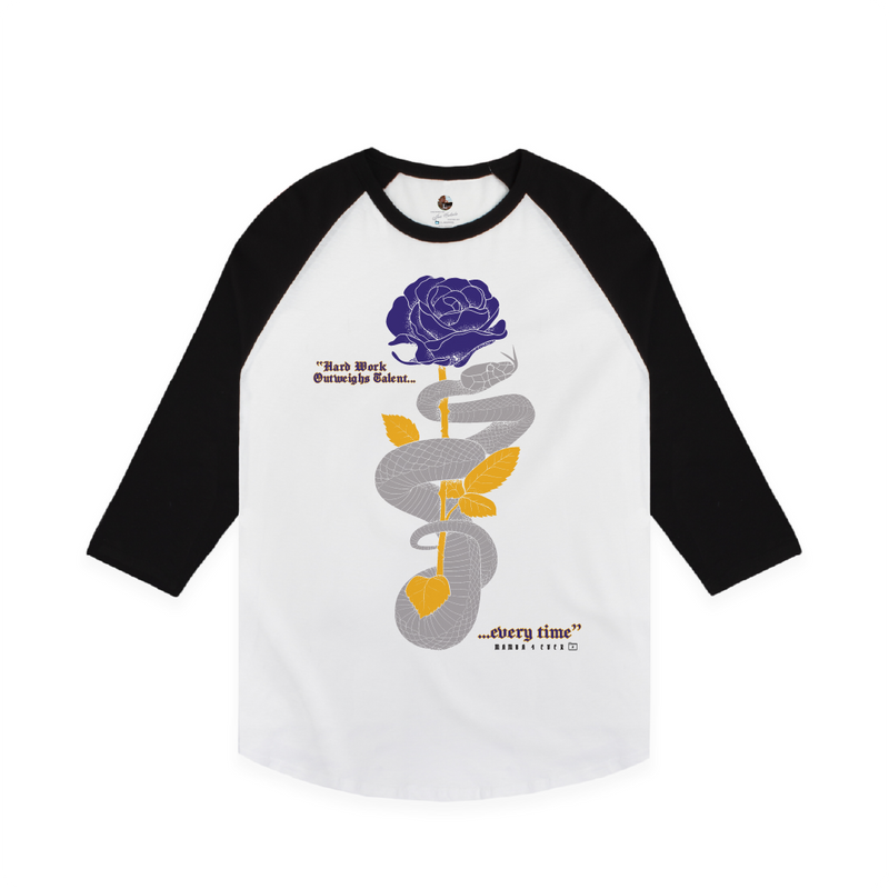 Front view of a unisex white and black baseball shirt with a purple and gold rose and grey mamba snake on a white background with text that reads "Hard work outweighs talent...every time"