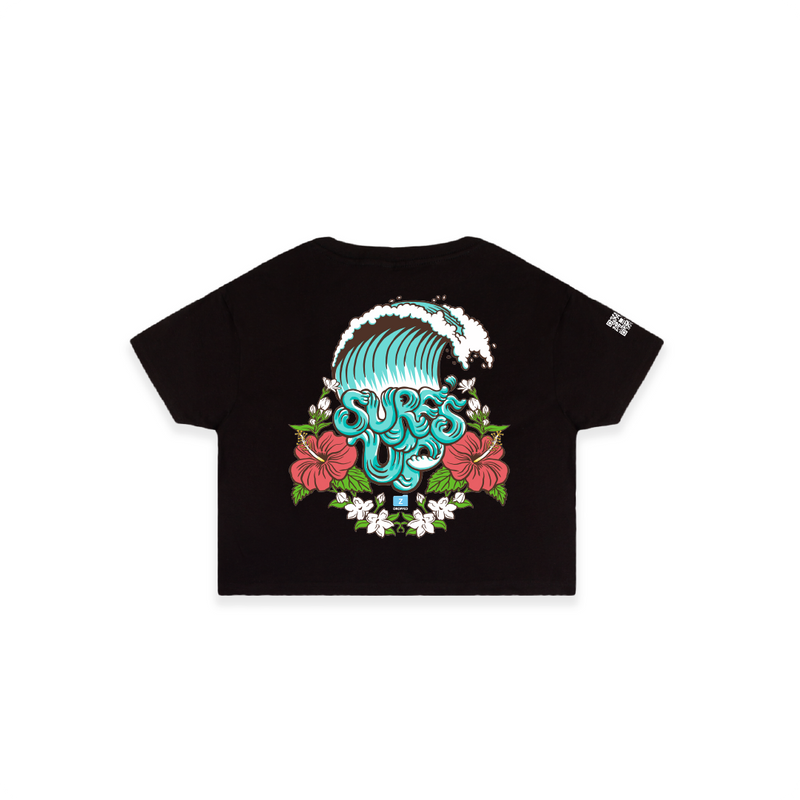Rear view of a womens black crop top t-shirt with a colorful wave and floral graphic on a white background
