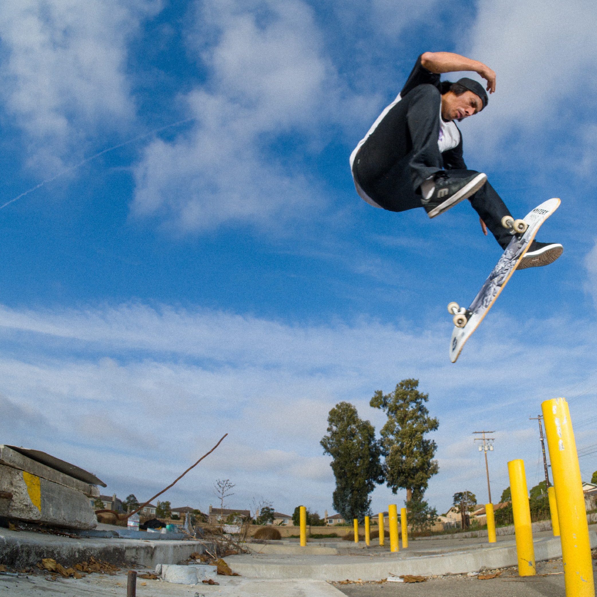 Professional skateboarder moose wearing a zdropped raglan while doing a trick for Thrasher Magazine.