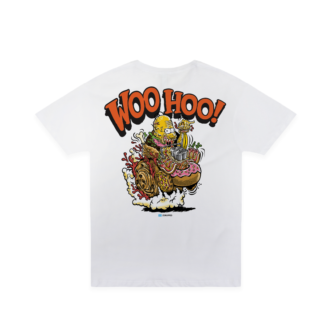 A white short-sleeve t-shirt with a large graphic print on the back. The graphic features the text 'WOO HOO!' in bold orange letters with black outlines, above a colorful cartoon illustration of a yellow creature riding a junk food hot rod.