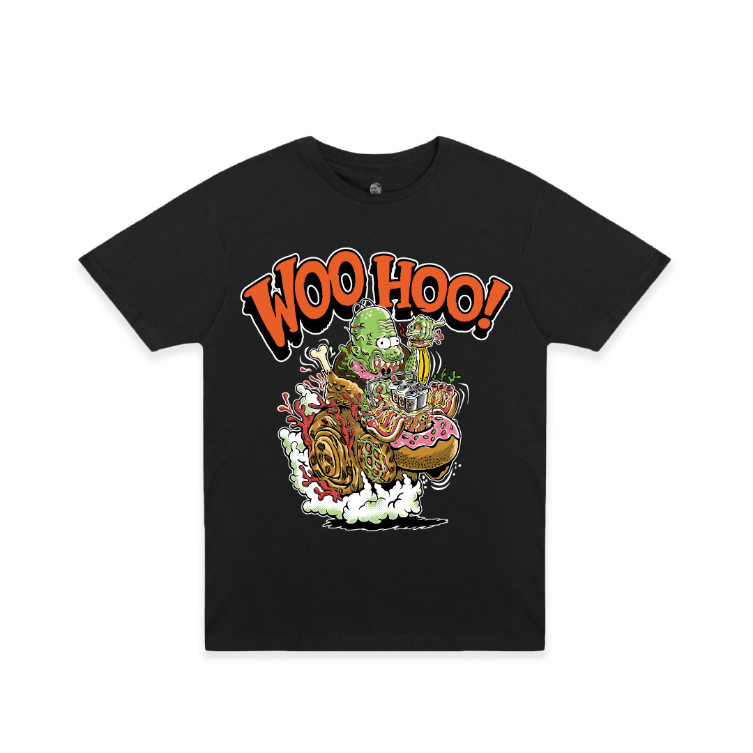 A black short-sleeve crewneck t-shirt featuring a colorful graphic of a green cartoon character riding a junk food hot rod, with the text 'WOO HOO!' in orange above it, displayed on a clean white background.