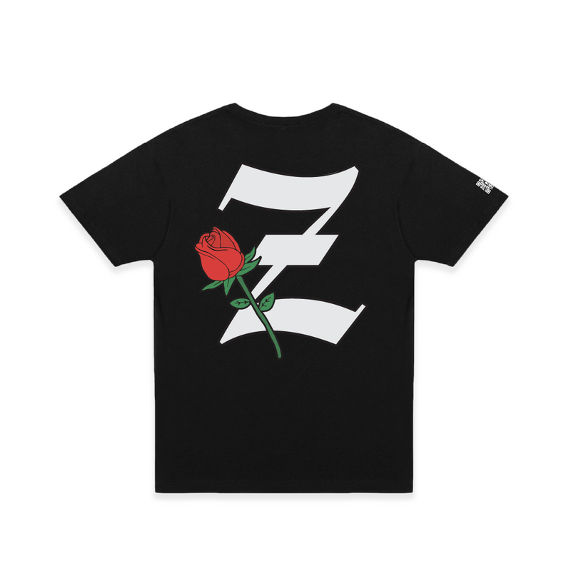 Rear view of a unisex black t-shirt with a large white 'Z' logo and red rose flower on a white background