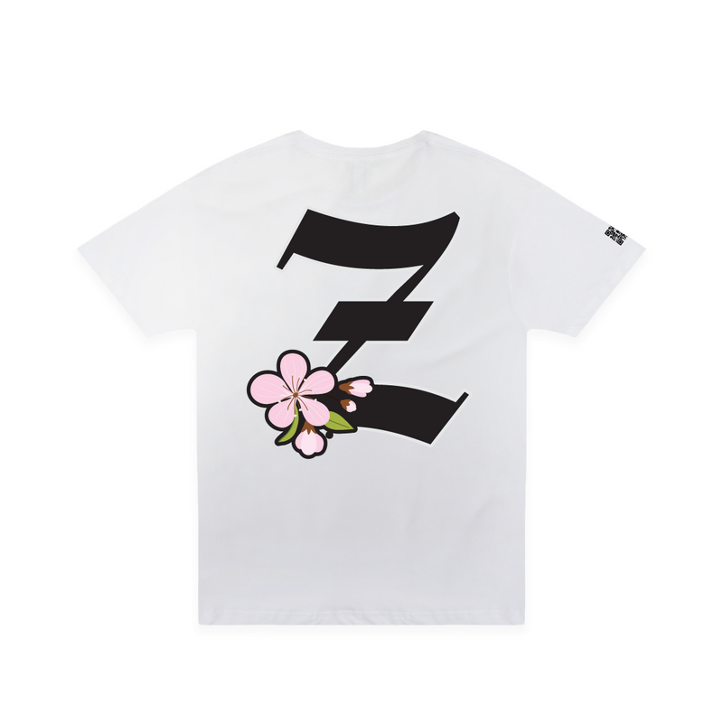 Rear view of a white unisex t-shirt with a large black 'Z' logo and pink cherry blossom flower on a white background.