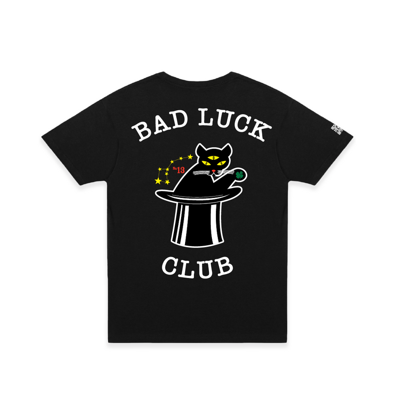 Rear view of a Black crew neck t-shirt with 'BAD LUCK CLUB' text and a graphic of a three eyed cat coming out of a magicians hat.