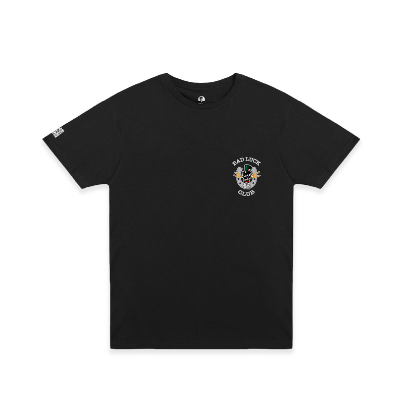 Front view of a unisex black crew neck t-shirt with white 'BAD LUCK CLUB' text and a small graphic including a laughing skull, dice, and lightning bolts on a white background.