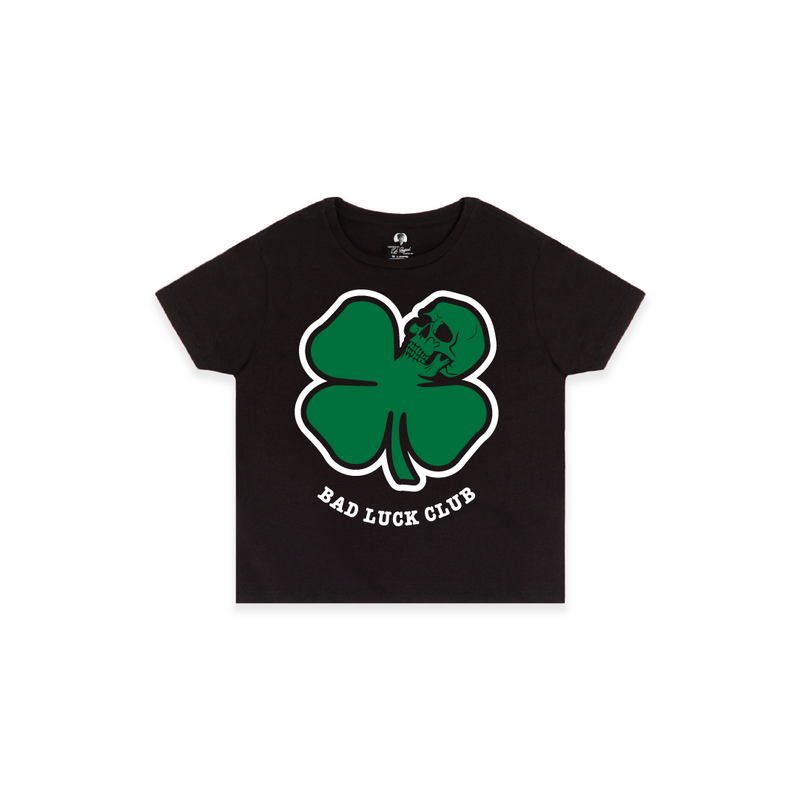 Front view of a black high waisted t-shirt with a large green skull death clover graphic and 'Bad Luck Club' text.