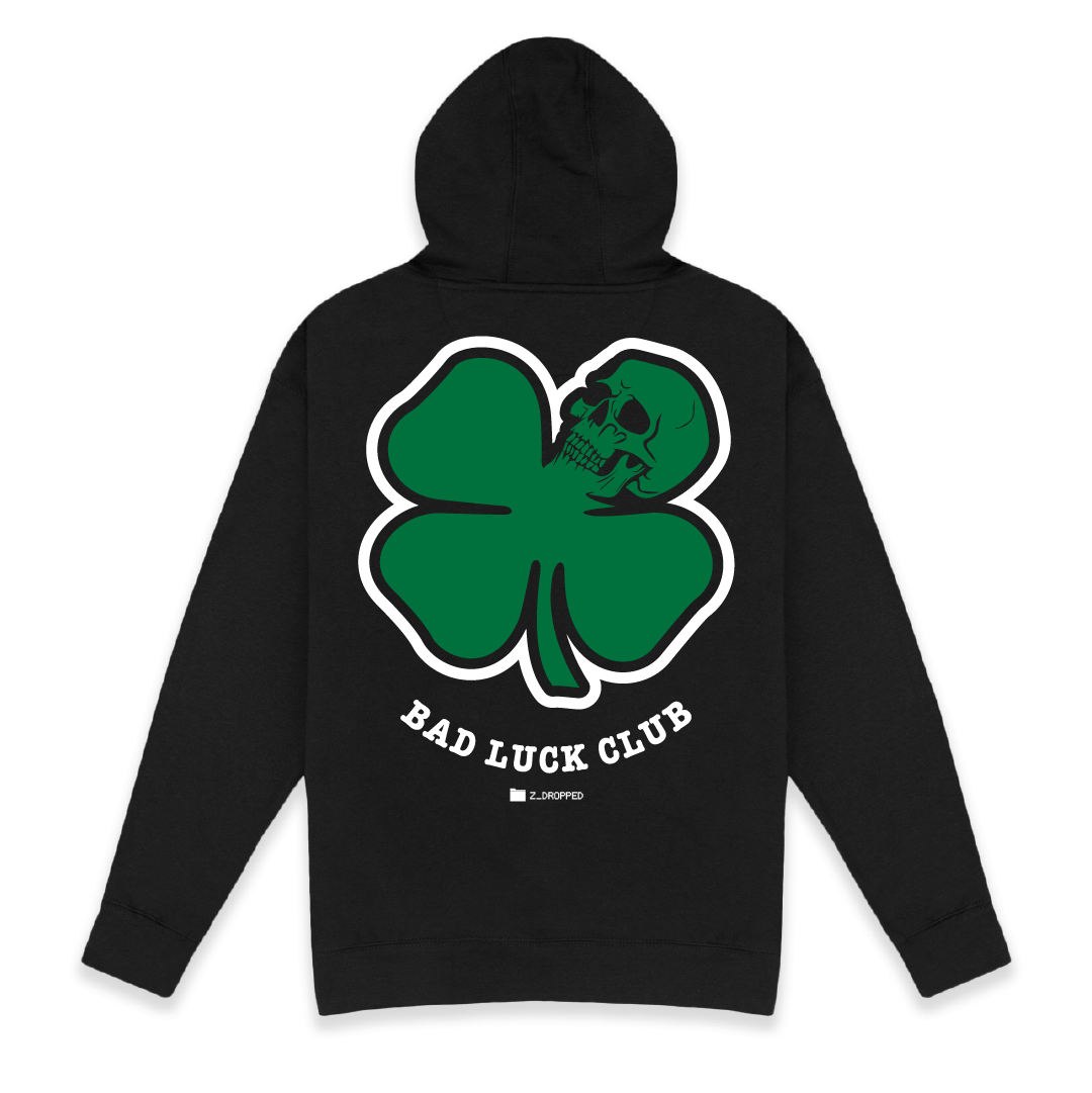Rear view of a unisex black hoodie with 'Bad Luck Club' design on the back, featuring a green death clover with skull.