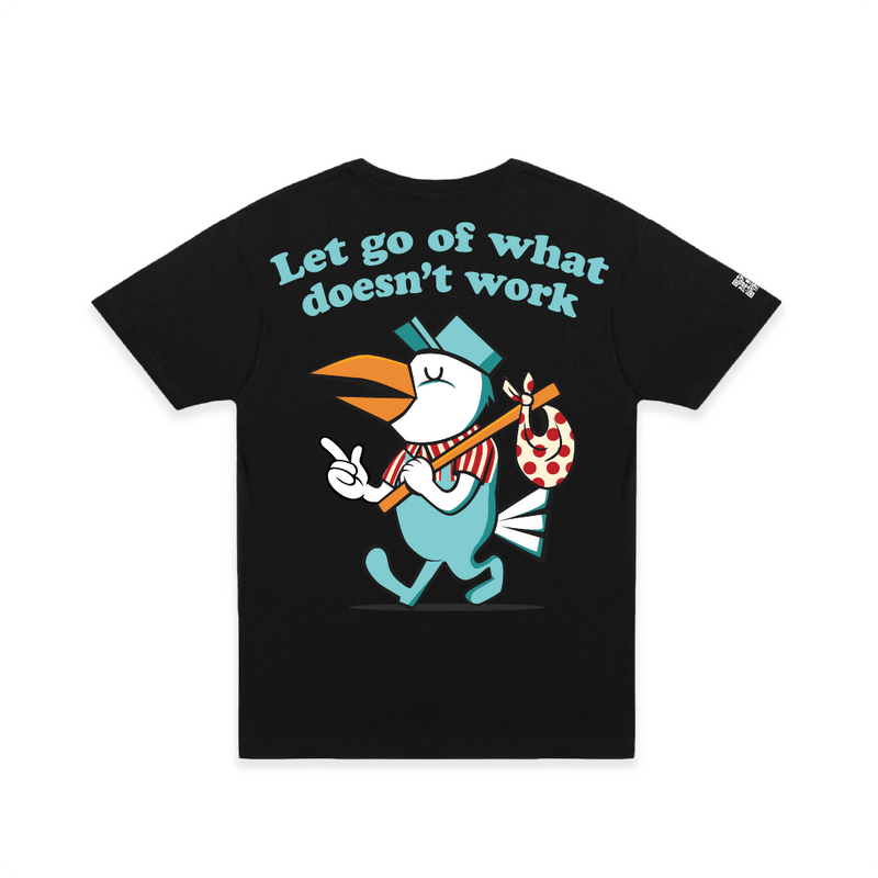 Rear view of a unisex black t-shirt with a large cartoon pelican bird and blue 'let go of what doesn't work' text.