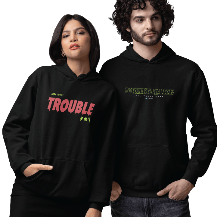 Two people wearing black hoodies with text designs on a white background