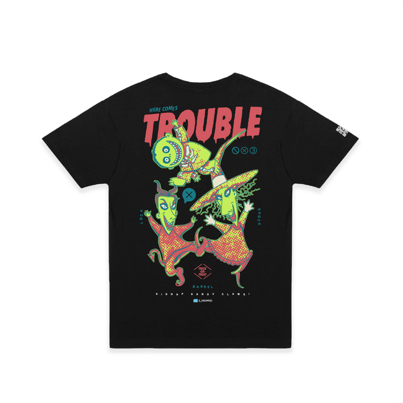 Front view of a black t-shirt with colorful lock shock and barrel and 'Here Comes Trouble' text on a white background