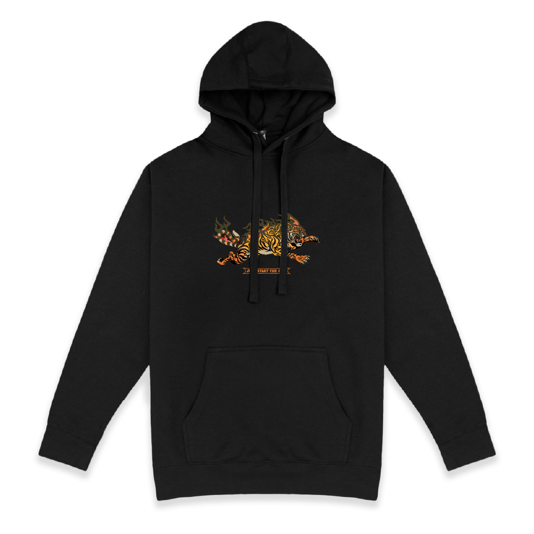 Front view of a unisex black hoodie with a small flaming leaping tiger graphic on the chest against a white background