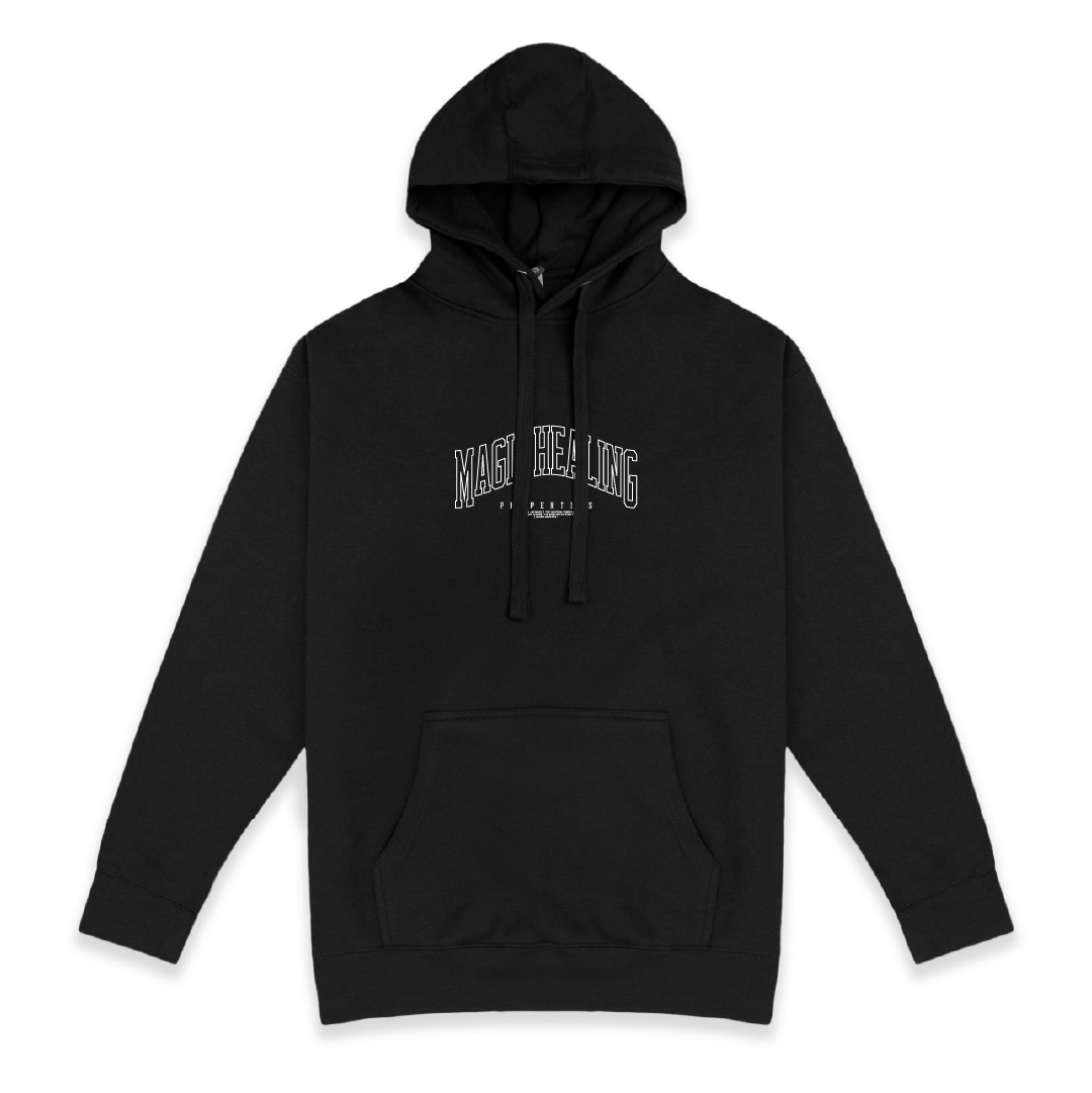 Front view of a unisex black hoodie with Magic Healing text on a white background