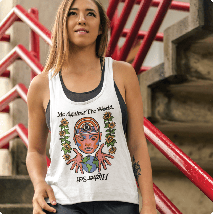 Woman wearing a mens white tank top with a zdropped graphic an urban setting