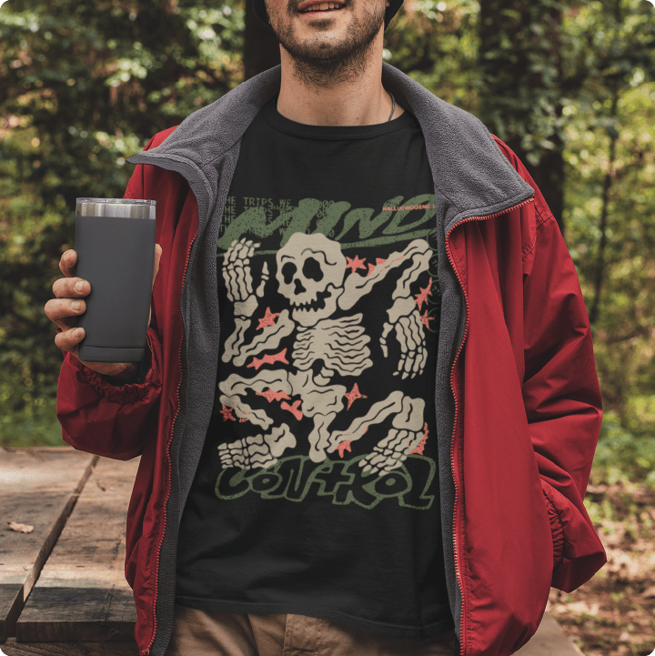 Person wearing a black t-shirt with a skeleton design outdoors