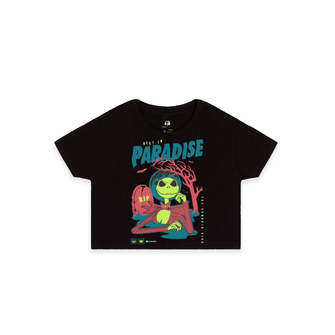 Front view of a womens black crop top shirt with a colorful skeleton graphic featuring a 'Rest in Paradise' text on a white background.