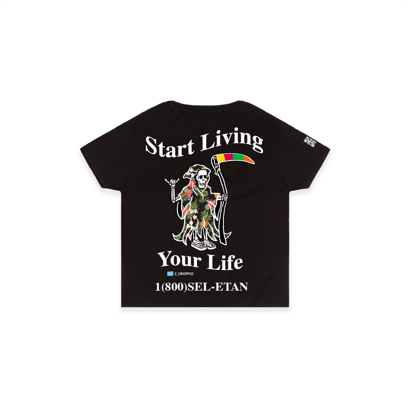 Rear view of a womens black high waist t-shirt with 'Start Living Your Life' text and grim reaper skeleton on a white background