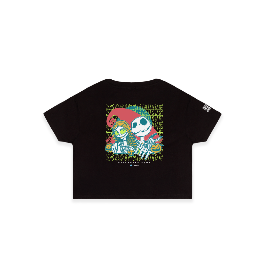 Rear view of a womens black crop top with neon green cartoon skeletons and 'NIGHTMARE' text on a white background.