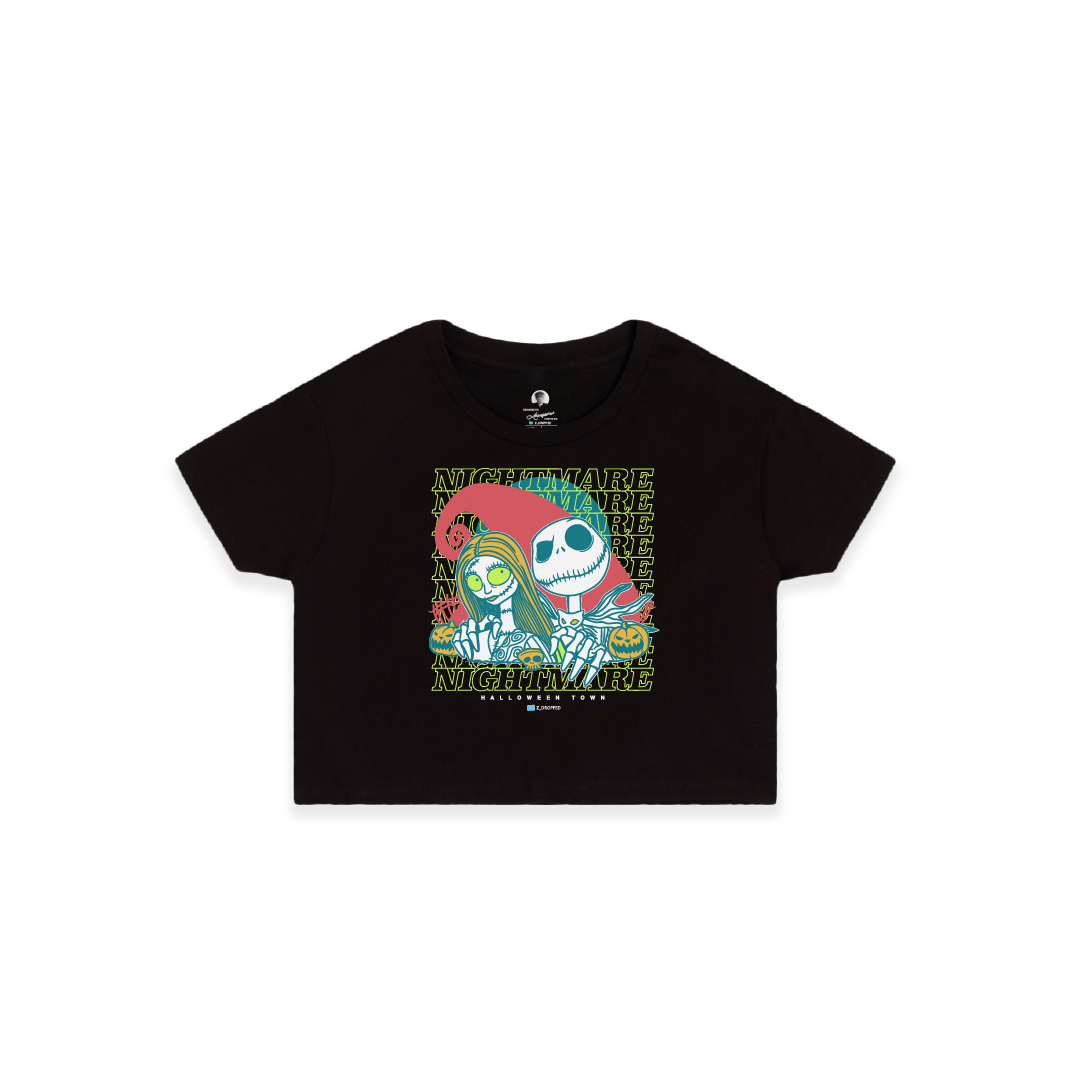 Front view of a womens black crop top with neon cartoon skeletons and 'NIGHTMARE' text on a white background.
