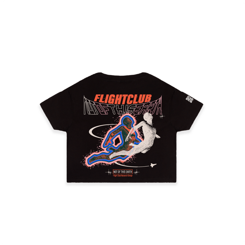 Back of black cropped t-shirt featuring “FLIGHTCLUB NOT OF THIS EARTH” text above two abstract humanoid figures in motion, surrounded by orbit lines and cosmic elements.