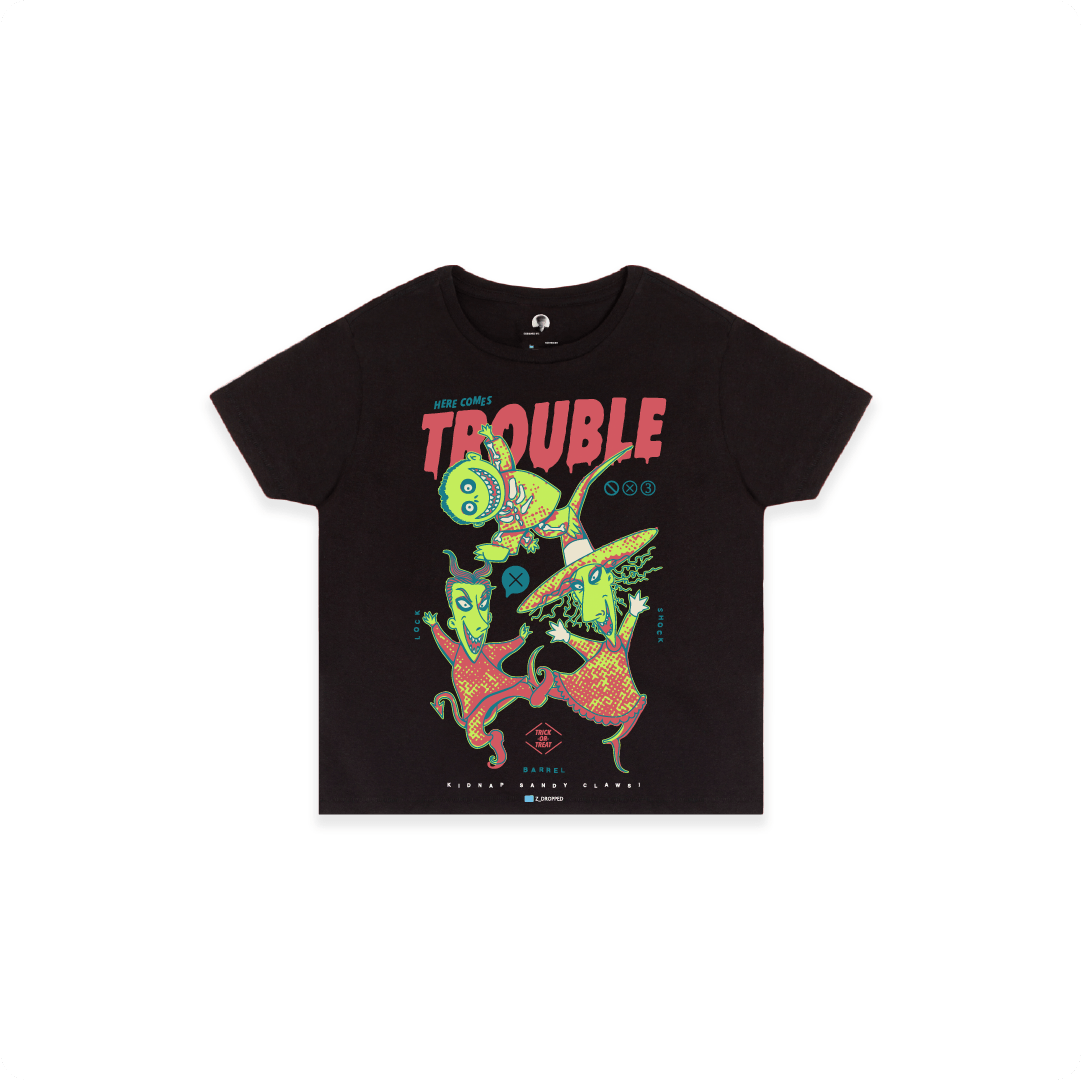 Front view of a black high waisted tee with colorful lock shock and barrel and 'Here Comes Trouble' text on a white background