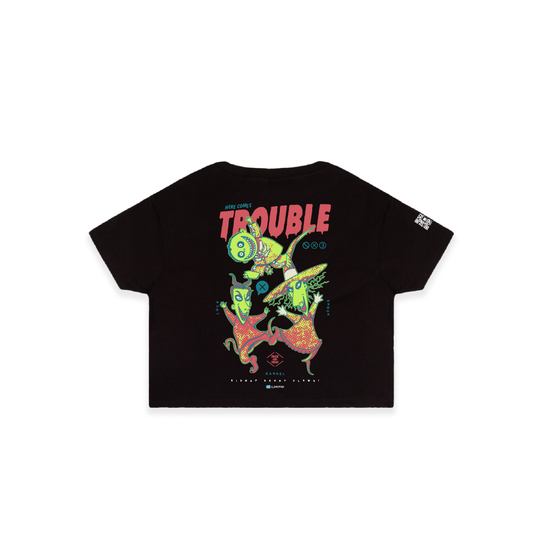 Rear view of a black crop top with colorful lock shock and barrel and 'Here Comes Trouble' text on a white background
