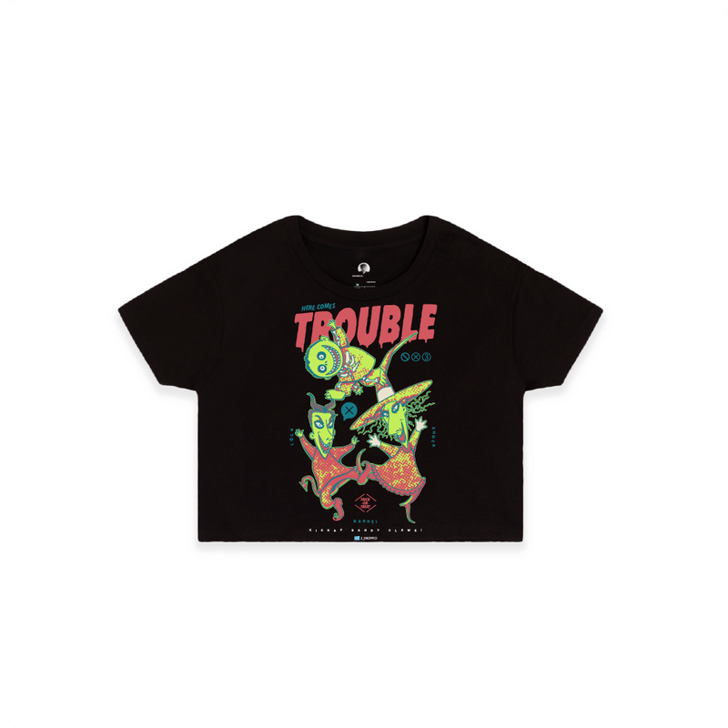 Front view of a black crop top with colorful lock shock and barrel and 'Here Comes Trouble' text on a white background