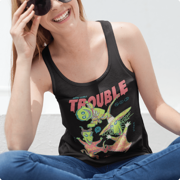 young girl wearing a black racer back tank top with colorful lock shock and barrel and 'Here Comes Trouble' text