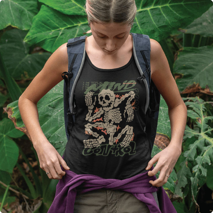 Person wearing a tank top with a skeleton design and a backpack in a natural setting