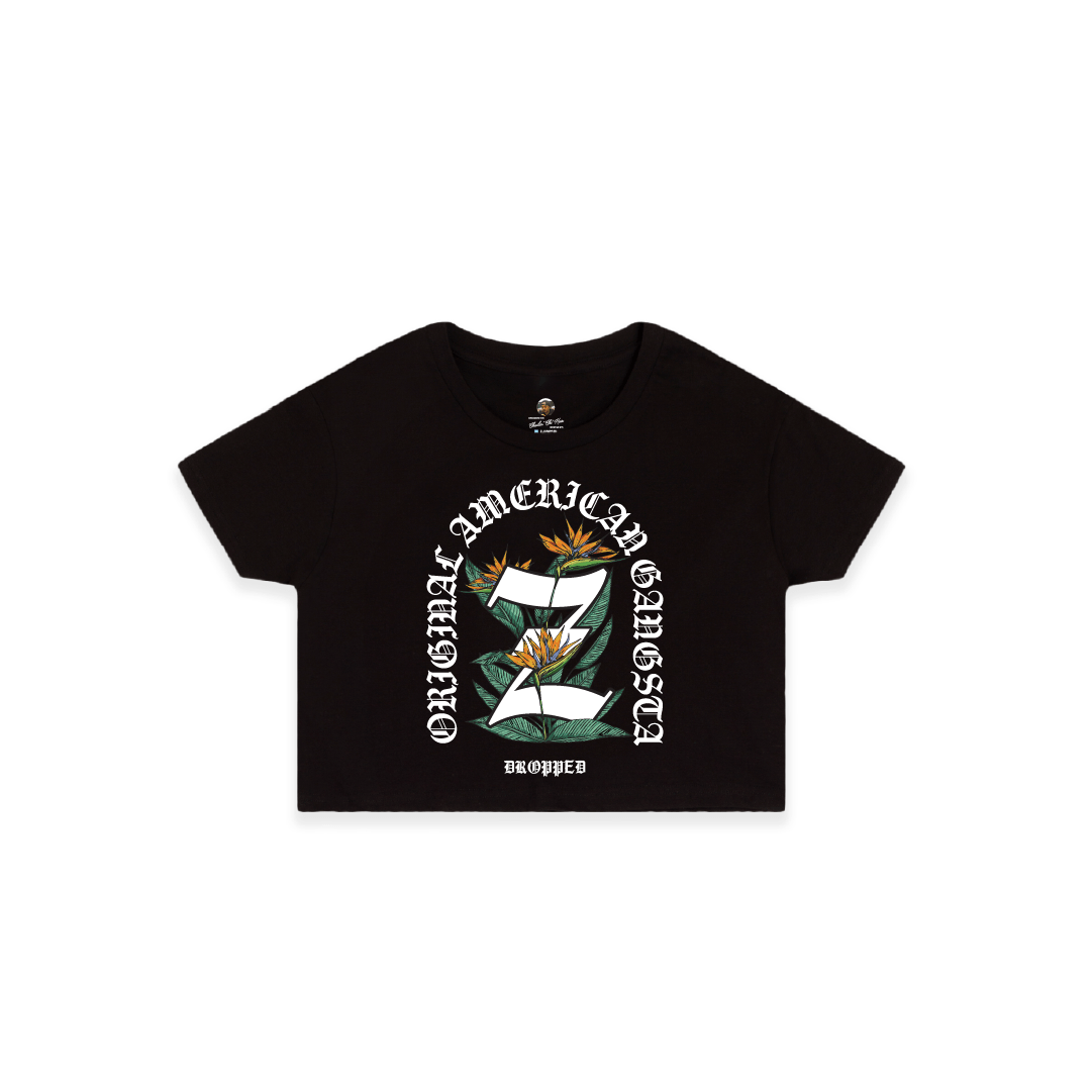Front view of a black crop top with a large Z logo and birds of paradise elements in the center with white'Original American Gangsta' text on a white background.