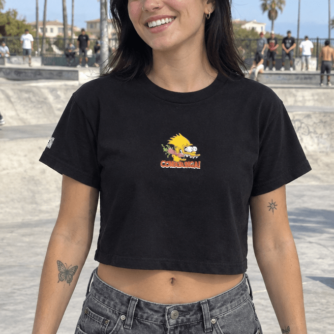 Woman wearing the black Bart Roth crop top, candid front view