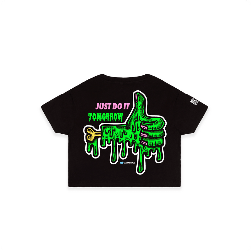 Black rear view of a women crop top with a dripping green thumb-up graphic and bold text ‘JUST DO IT TOMORROW’ on the front on a white background