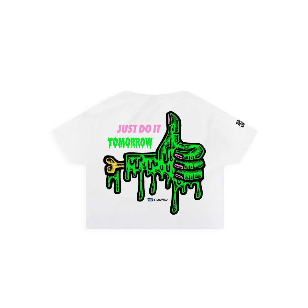 White back view of a women crop top with a dripping green thumb-up graphic and bold text ‘JUST DO IT TOMORROW’ on the front on a white background