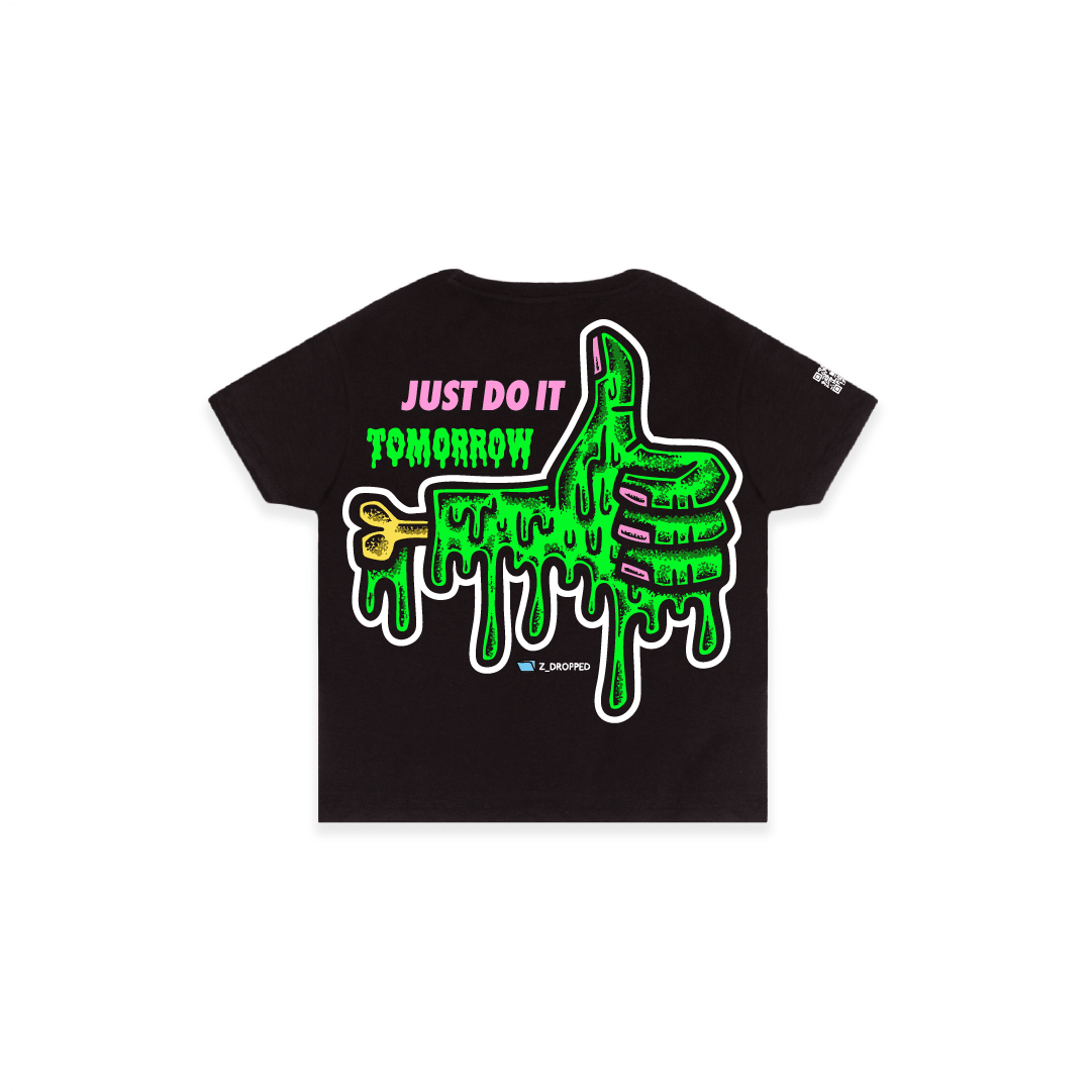 Black rear view of a women high waisted tee with a dripping green thumb-up graphic and bold text ‘JUST DO IT TOMORROW’ on the front on a white background