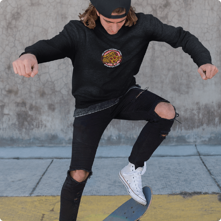 Person skateboarding in a black zdropped quarter pie pizza design with a concrete background.