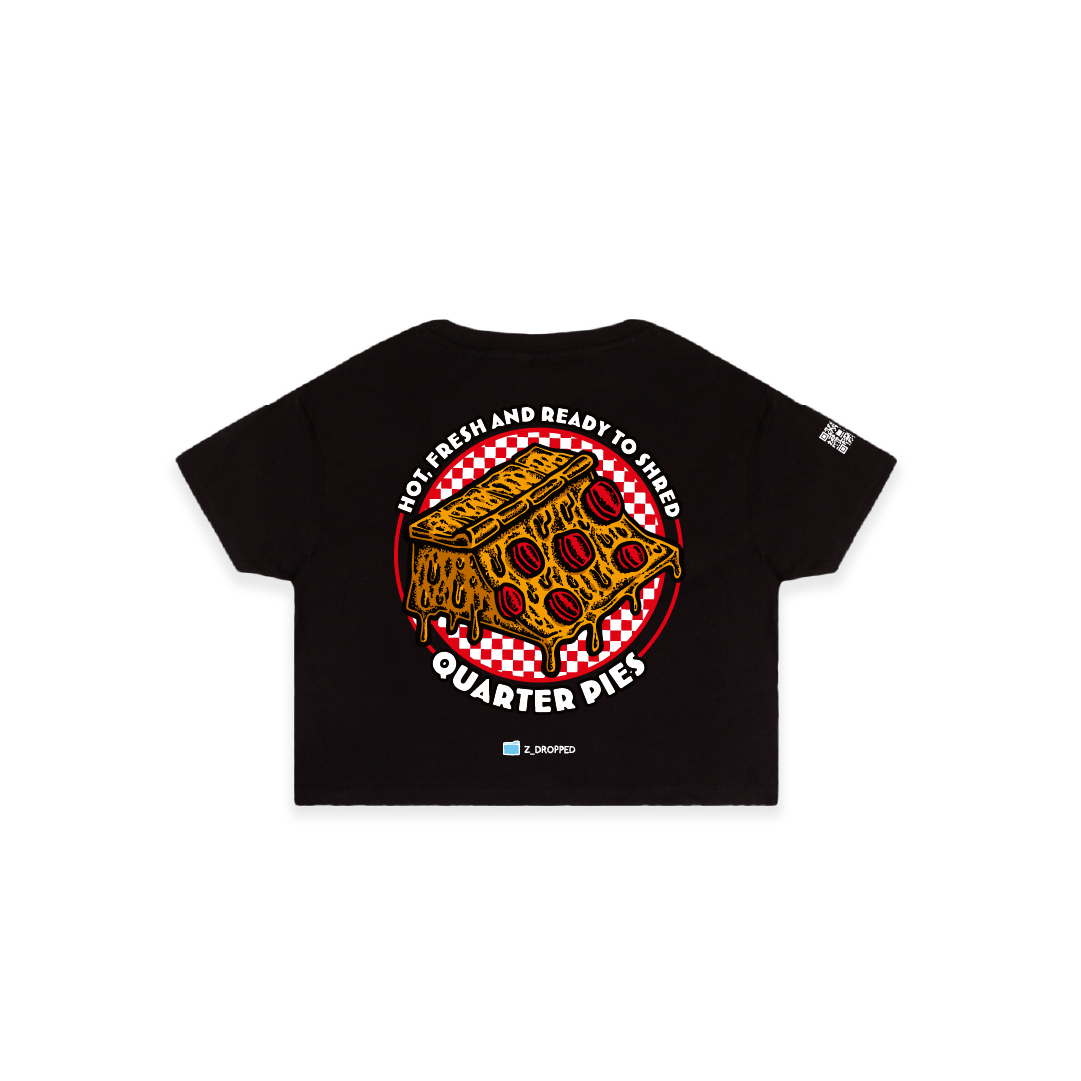 Rear view of a women crop top  with a colorful illustrated pizza slice graphic and the text “Hot, Fresh and Ready to Shred – Quarter Pies” on the front on a white background. 