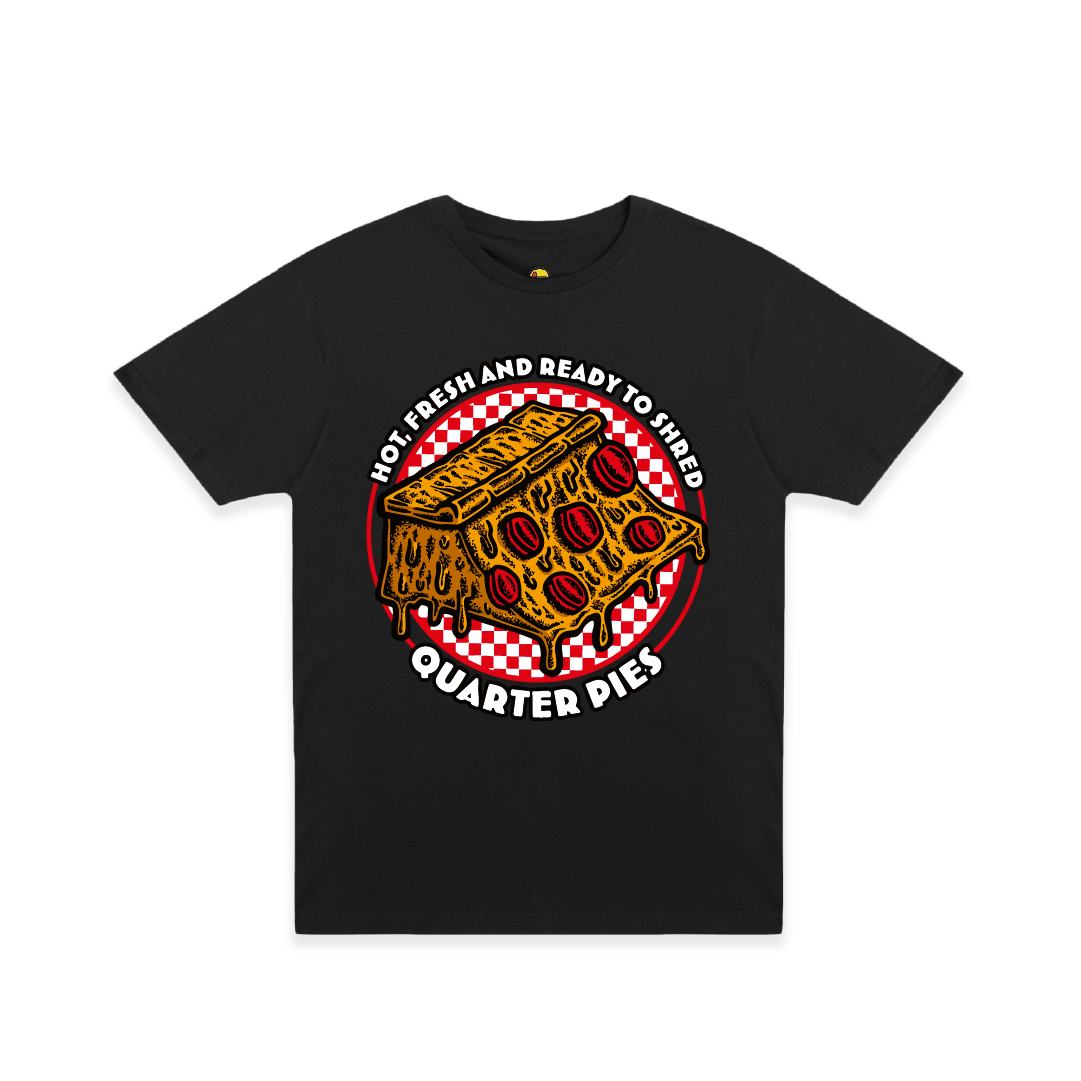 Front view of a unisex tee shirt with a colorful illustrated pizza slice graphic and the text “Hot, Fresh and Ready to Shred – Quarter Pies” on the front on a white background. 