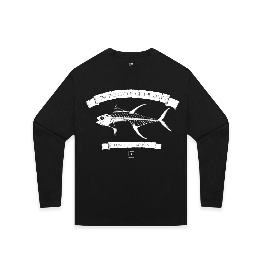 Front view of a black unisex long sleeve with a large white tuna bones fish and 'catch of the day' text on a white background