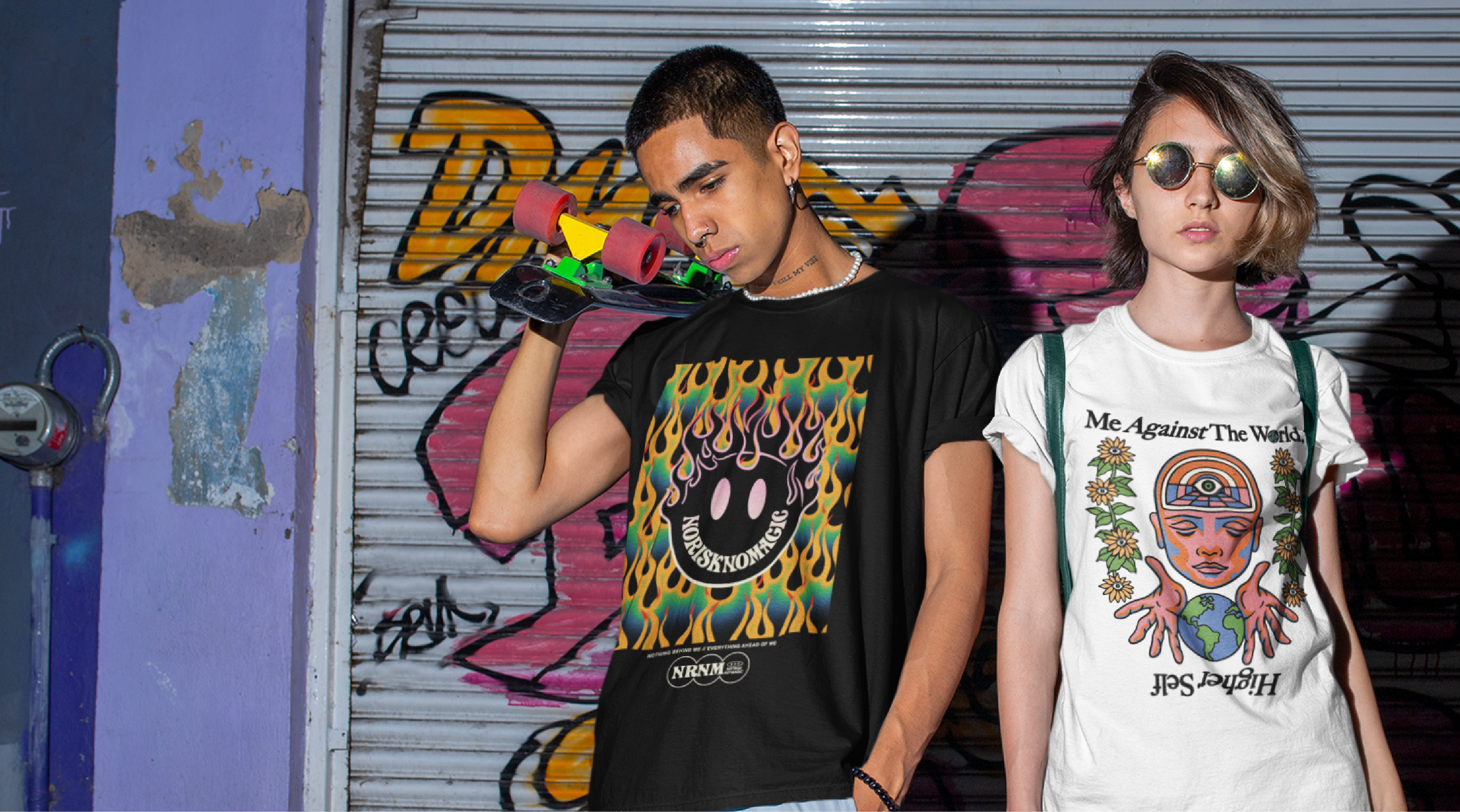 a young man and woman in zdropped chapter 1 apparel in a urban setting with graffiti on the wall