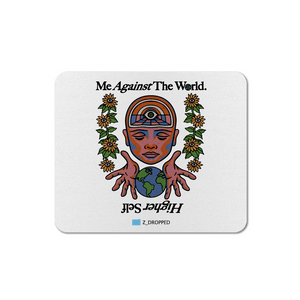Mousepad with a design of a face, hands holding a world map, and text 'Me Against The World. Higher Self' on a white background.