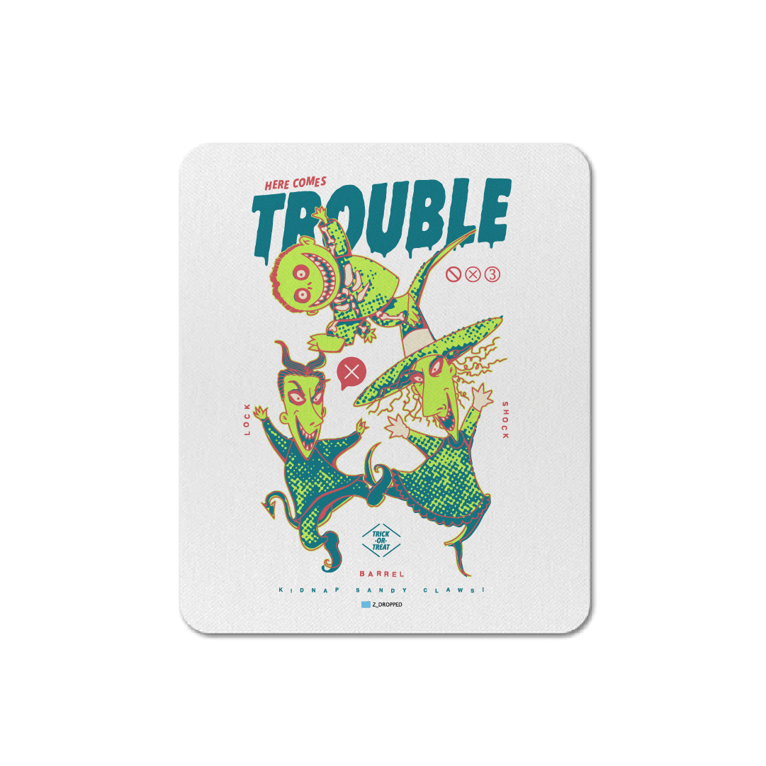 White mouse pad with cartoon characters and 'Here Comes Trouble' text on a white background