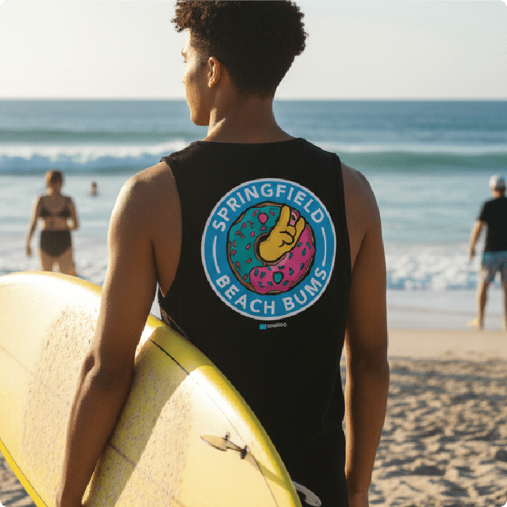 surfer wearing a black 'Springfield Beach Bums' tank top at the beach.