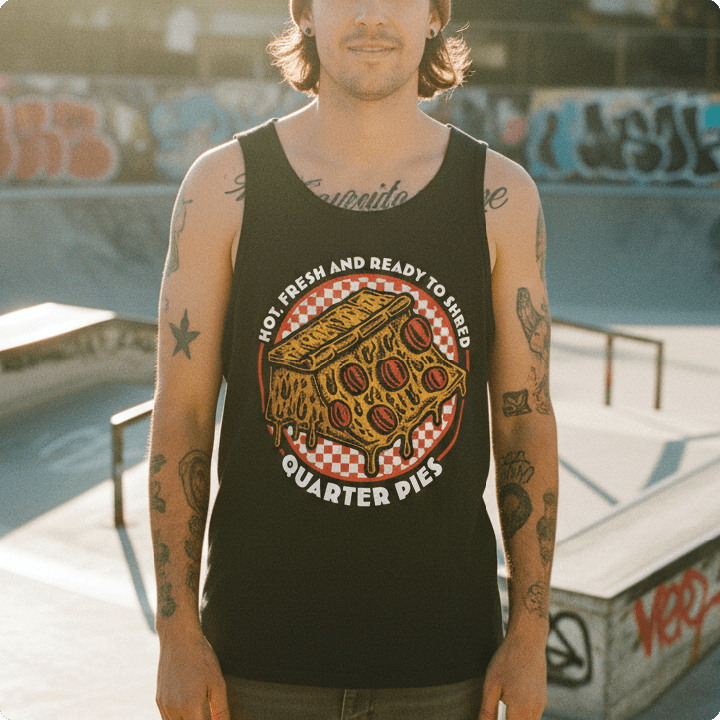 Person wearing a black tank top with a quarter pipe made of pizza and text at a skatepark