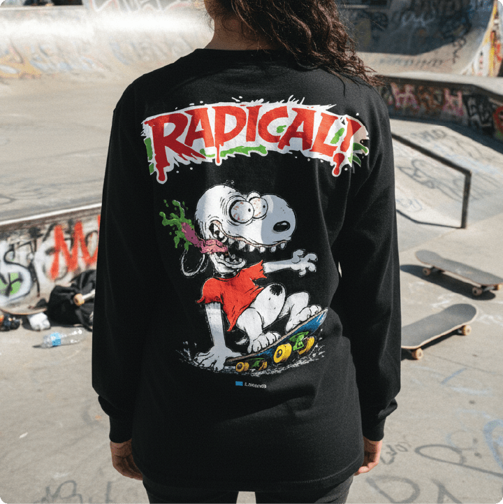 Person wearing a black long sleeve with a snoopy fink graphic design and 'RADICAL!' text at a skate park.